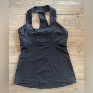Lululemon Size 8 Tank Top. Built in shelf bra. Good condition.